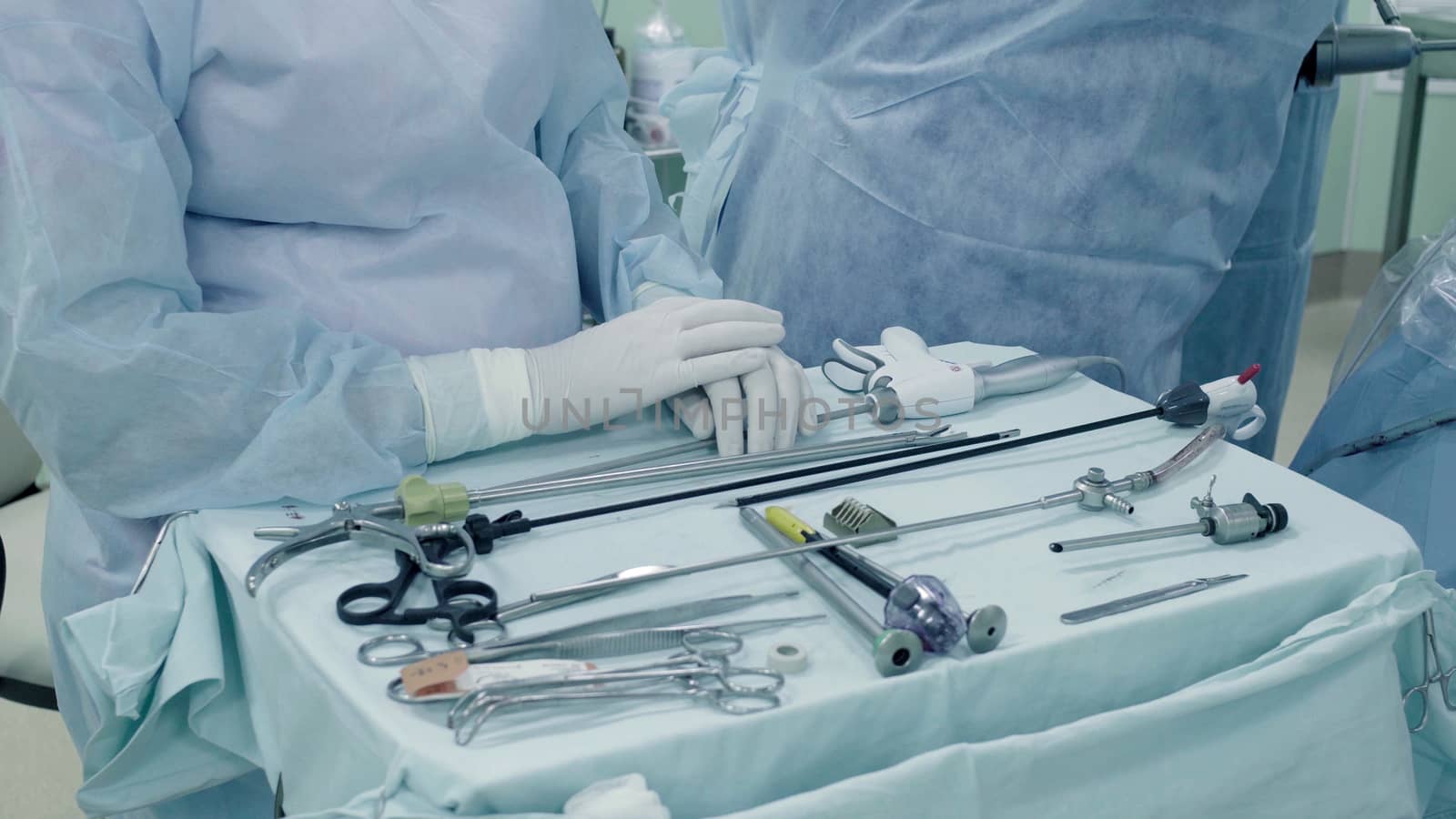 Laparoscopic surgery of the abdomen. The surgical nurse prepares the medical instrument