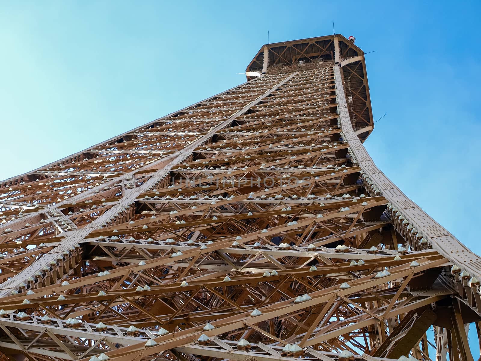 View from below of a fragment of the Eiffel Tower by anmbph