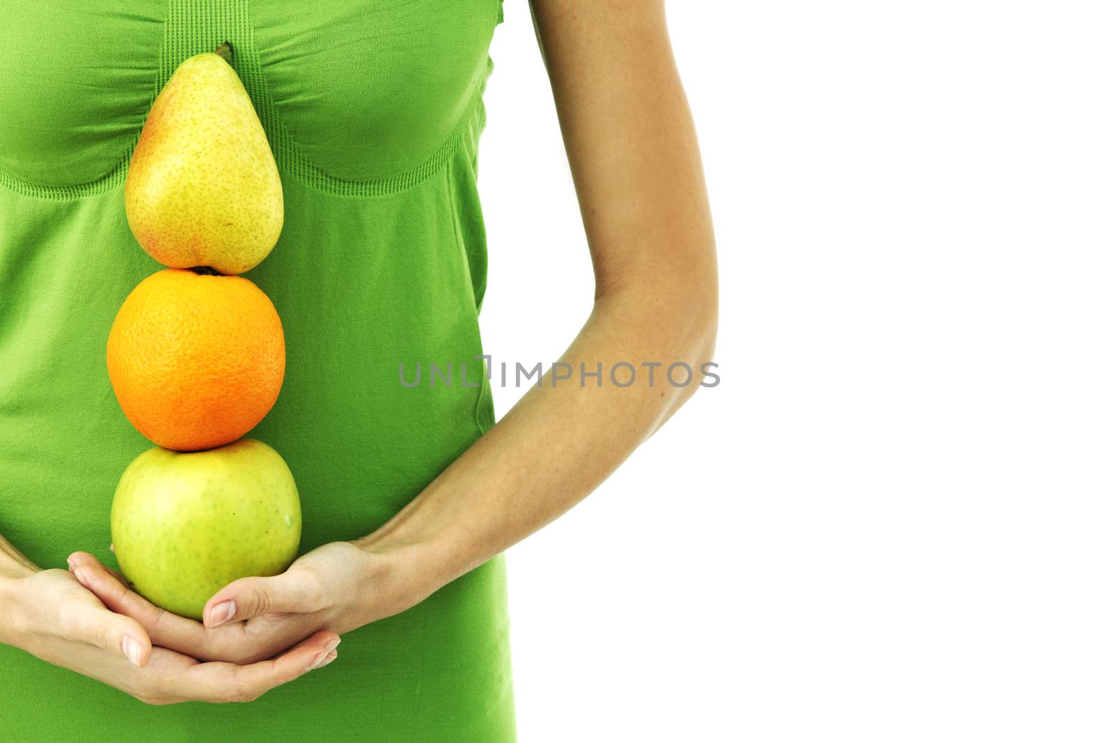 fruit pile in woman hands on white