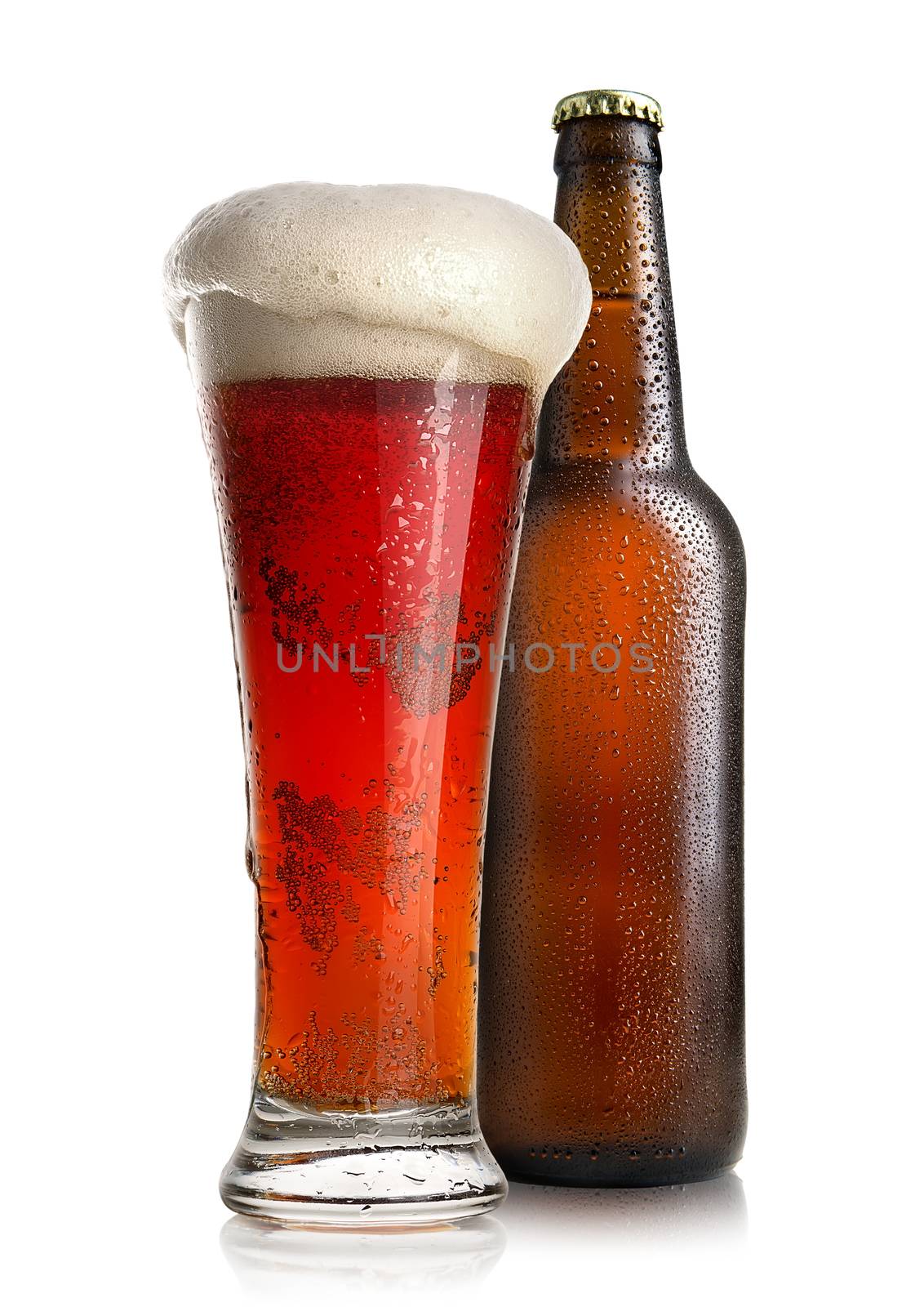 Red beer in a glass near bottle isolated on a white background