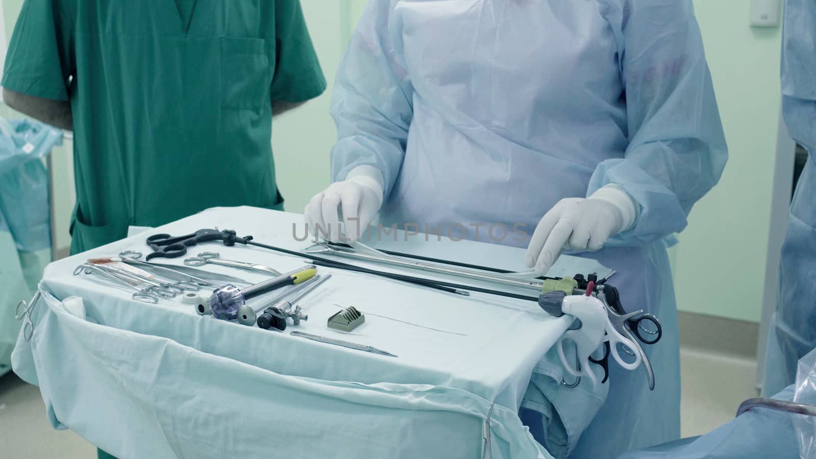 Laparoscopic surgery of the abdomen. The surgical nurse prepares the medical instrument