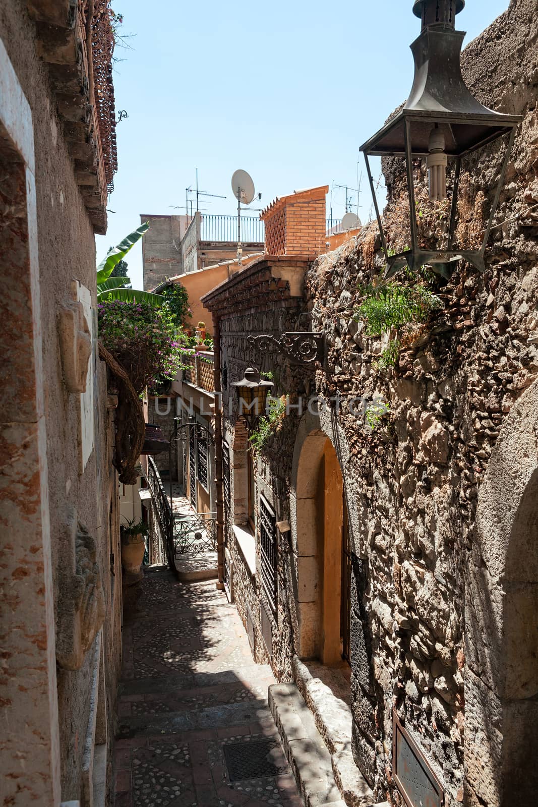 Typical ancient alley in Taormina, Sicily, Italy