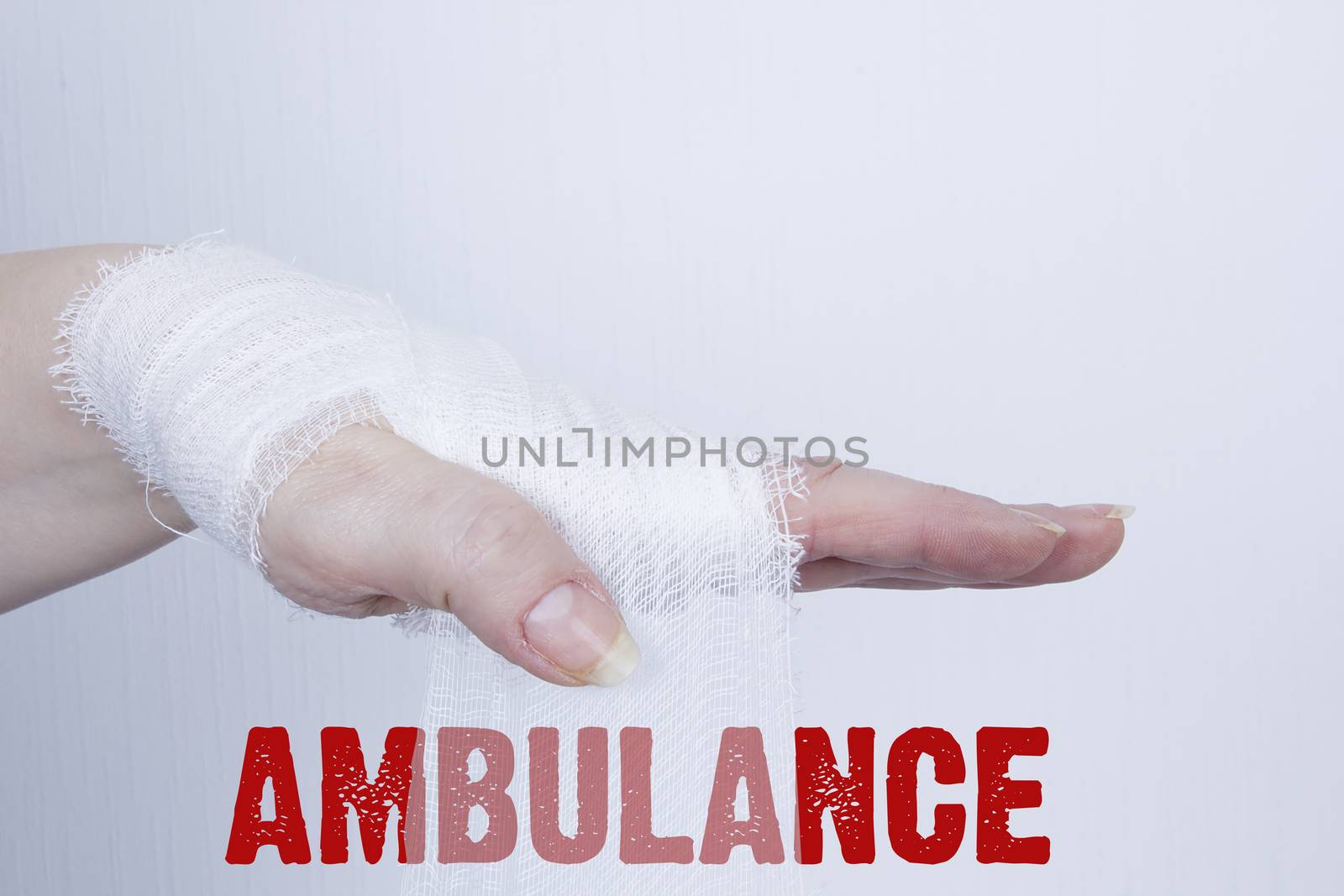 White medical dressing on a traumatized female hand