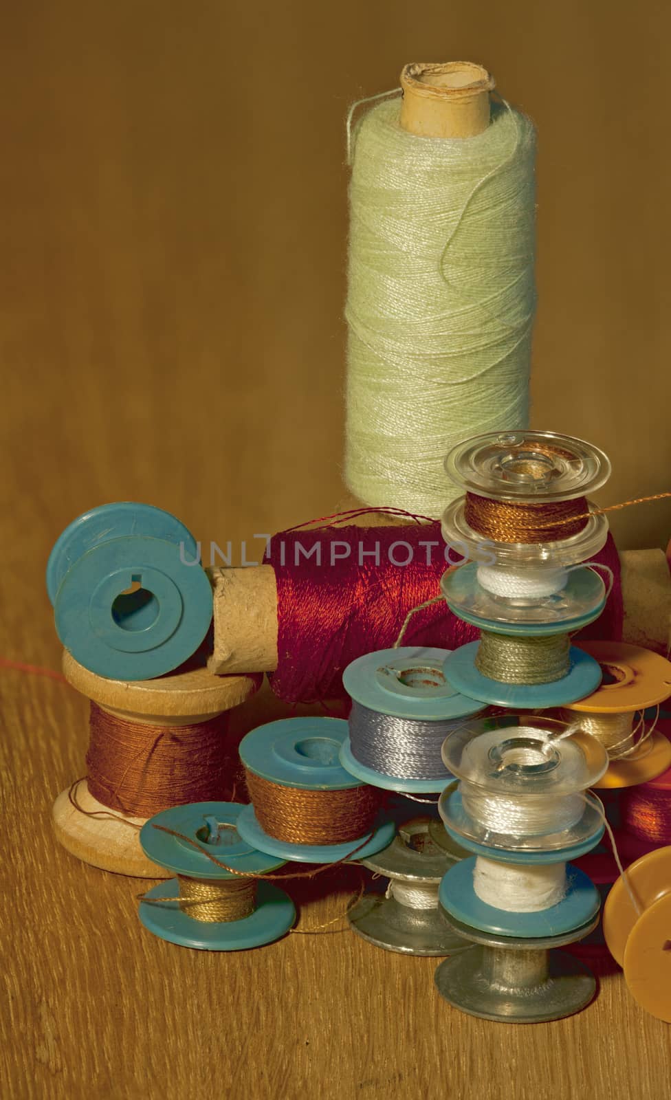 thread  on different sizes coil, bobbin, reel and spool