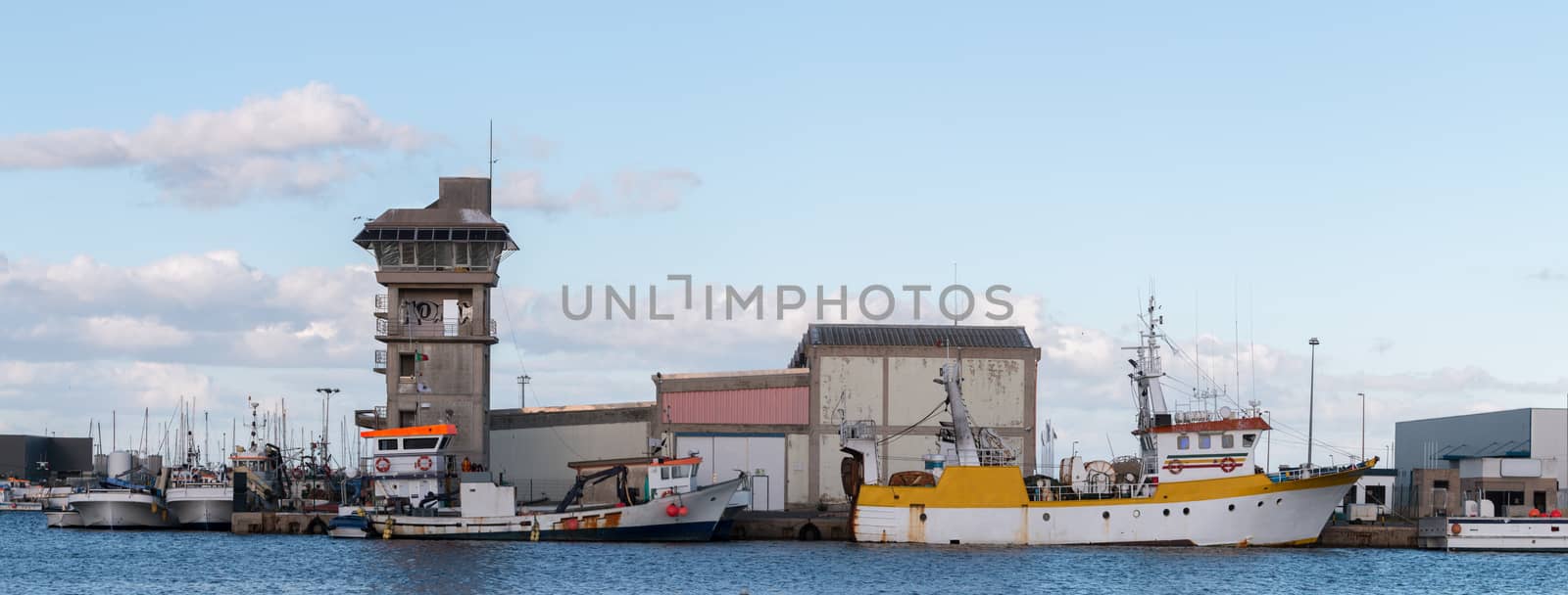 wide view of a traditional fishing dock on Olhao, Portugal.