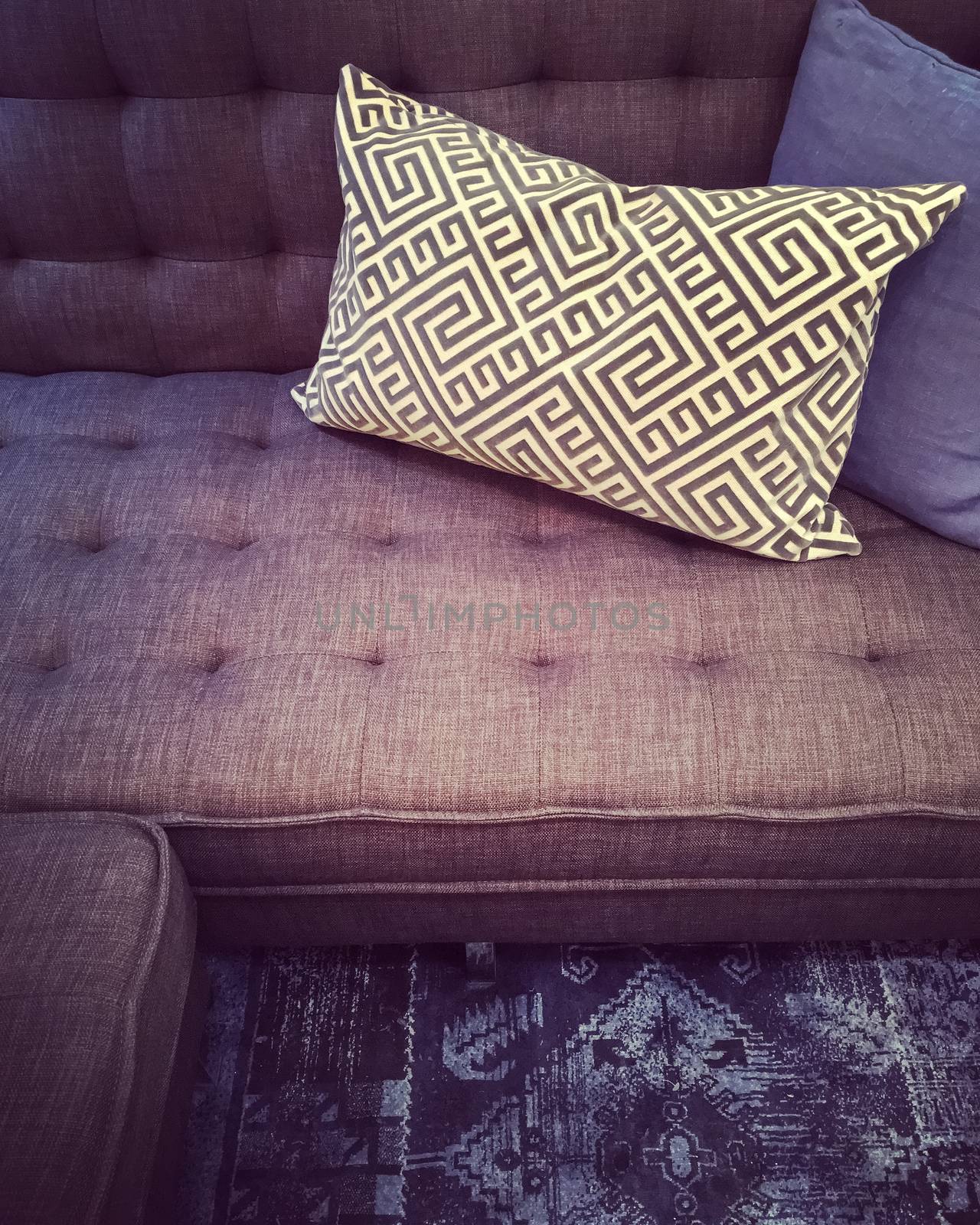 Fancy sofa with decorative cushions. Contemporary furniture.