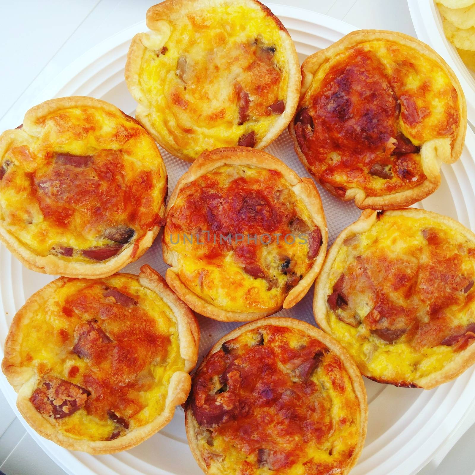mini quiches on a plate by membio