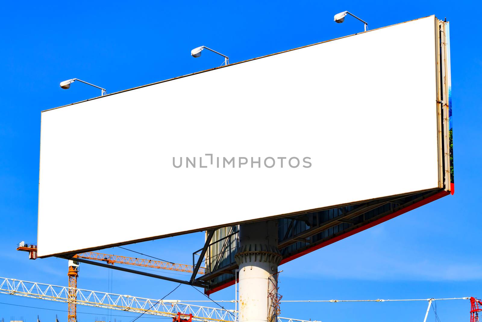 Large blank billboard with blue sky behind it. by Nobilior