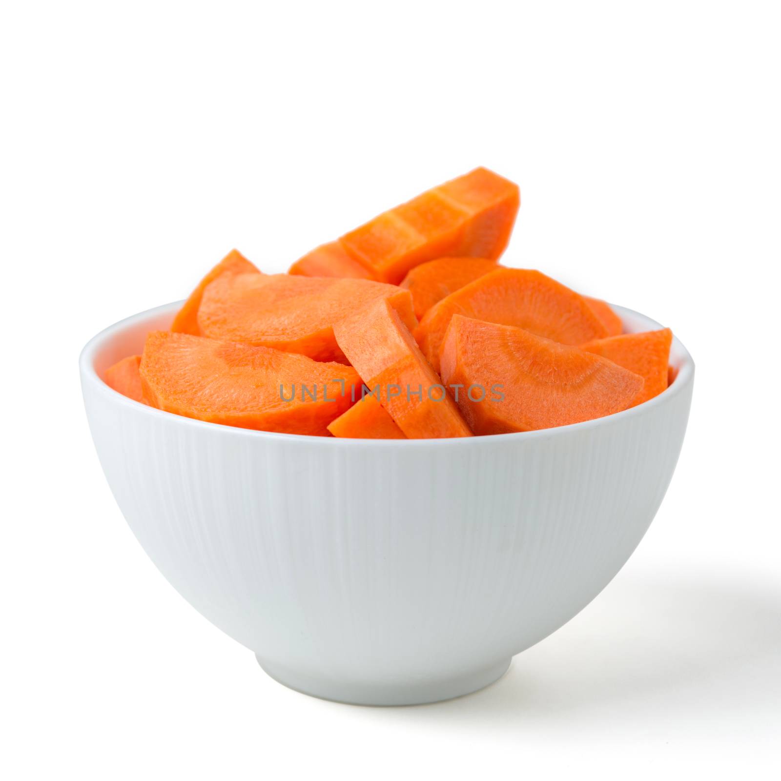 sliced carrots in bowl isolated on white