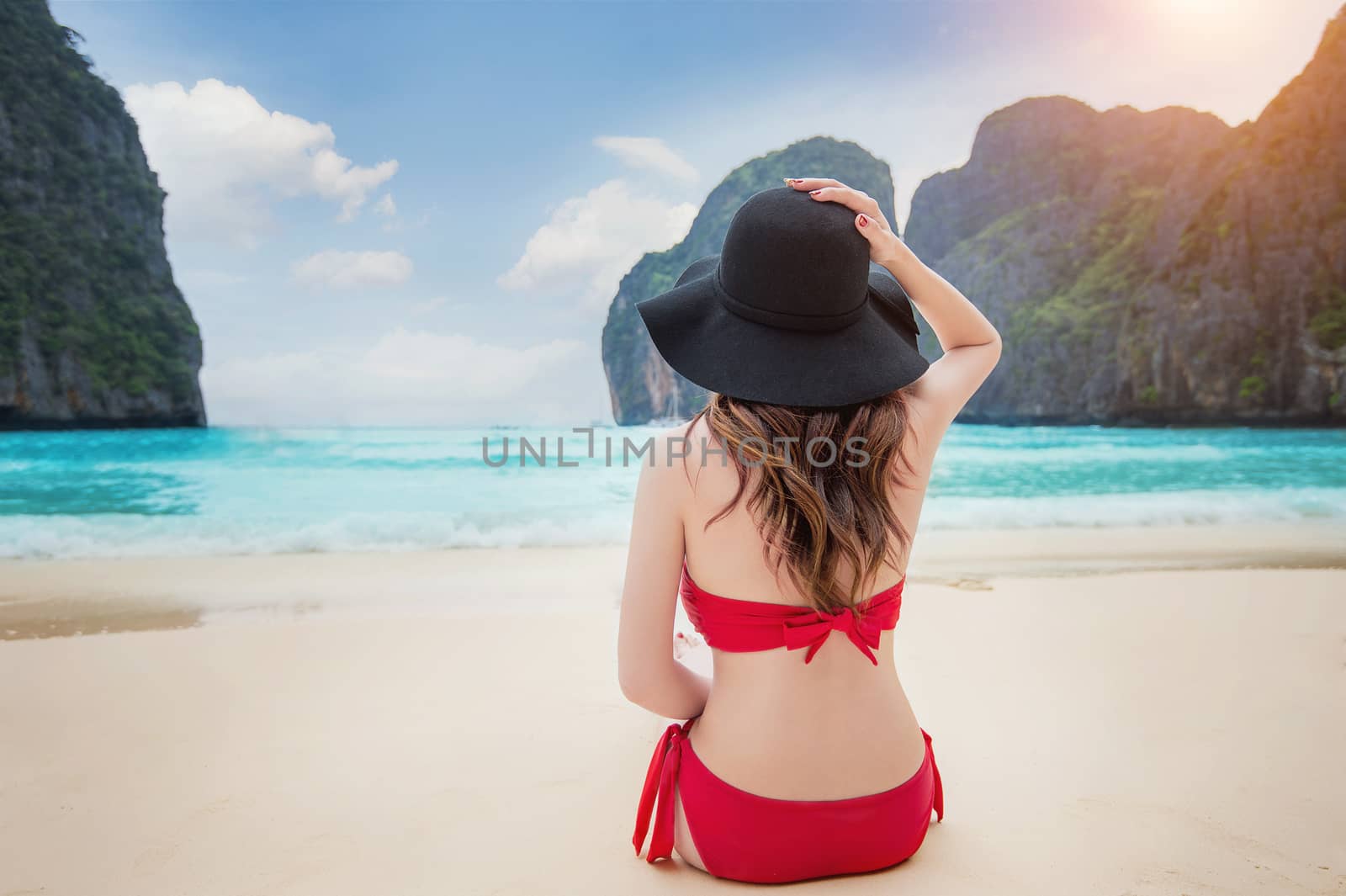Woman in bikini at beach. by gutarphotoghaphy