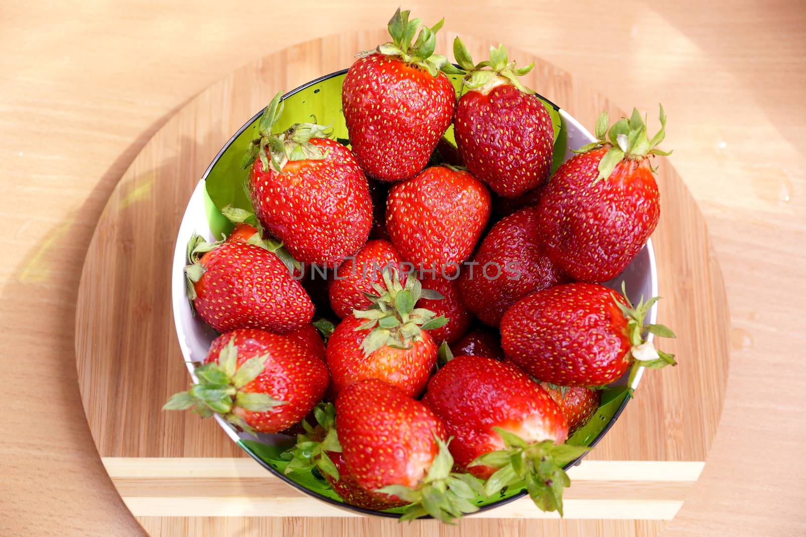 Fresh crop of strawberry from the Russian giving in a transparent salad bowl