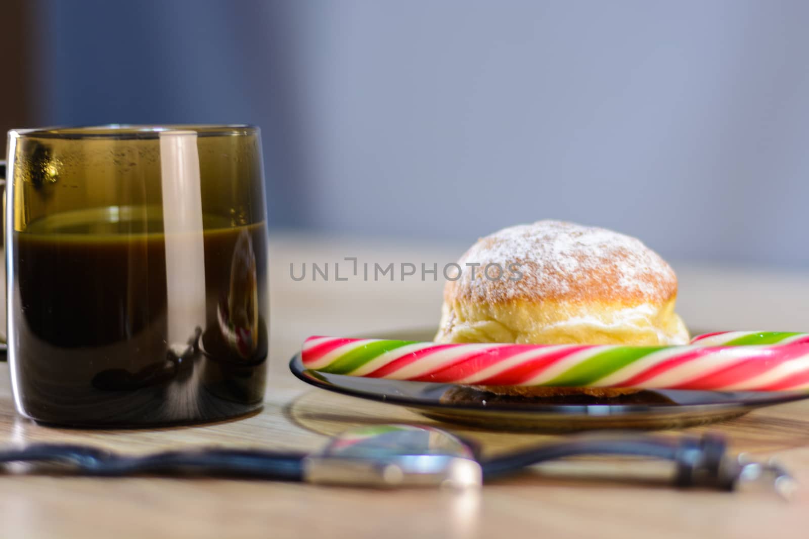 on the plate of a bun and candy along with coffee by boys1983@mail.ru