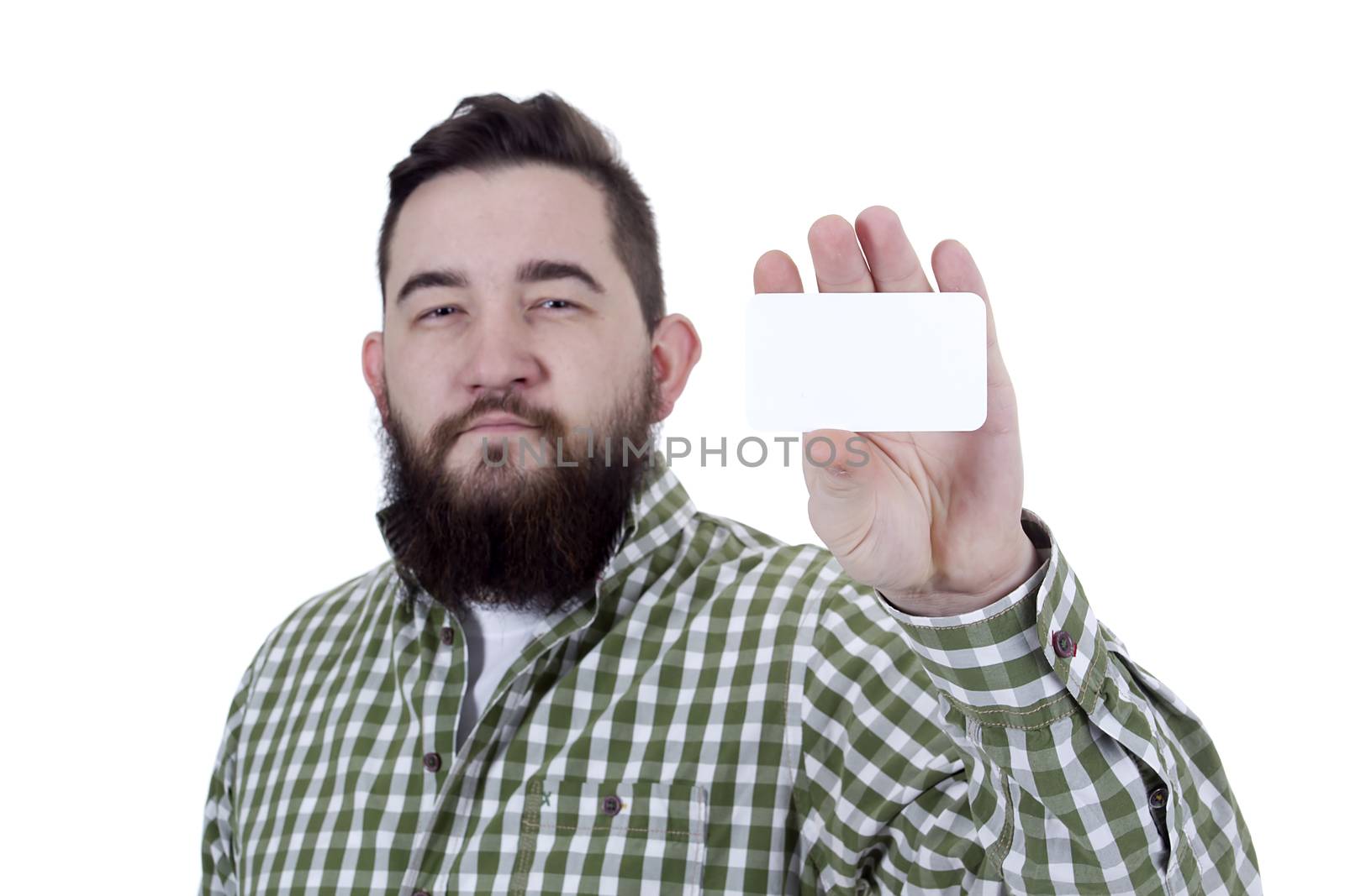 Young bearded man with a business card in his hand on a white background