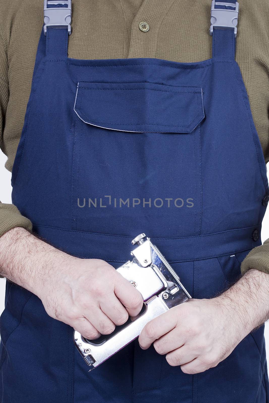Construction stapler in the hands of a worker by VIPDesignUSA