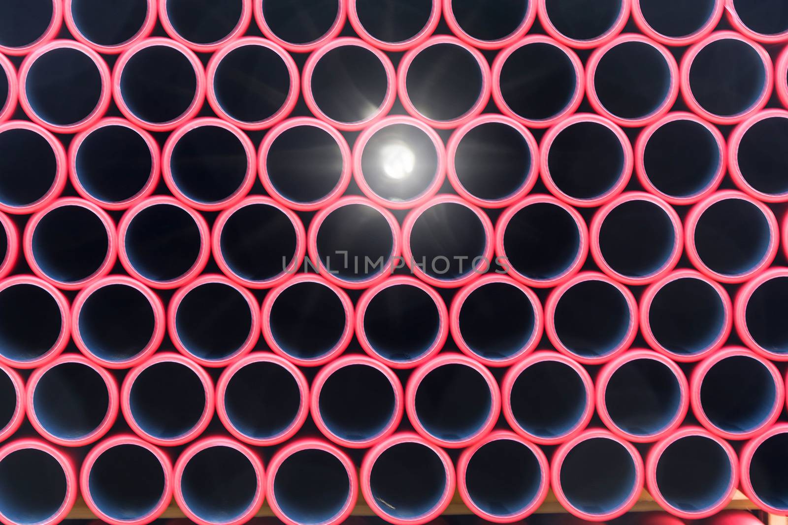Stockyard of various tubes and pipes at a construction site.