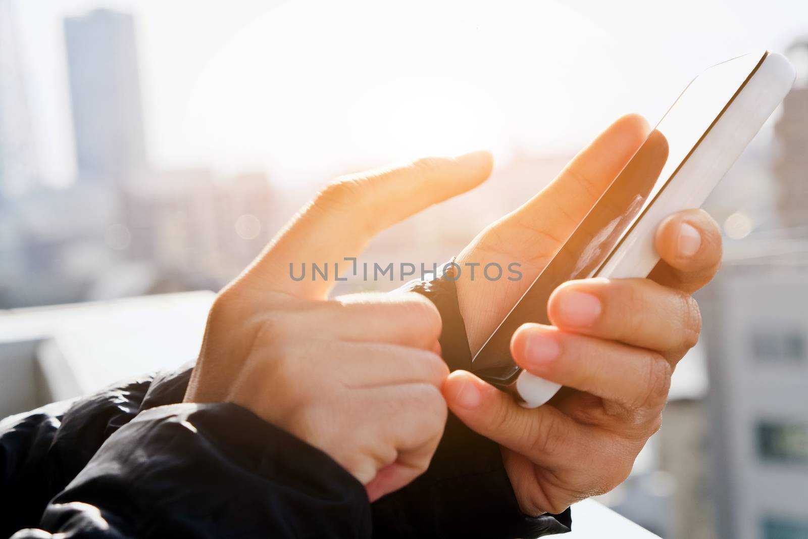close up of hand typing on phone