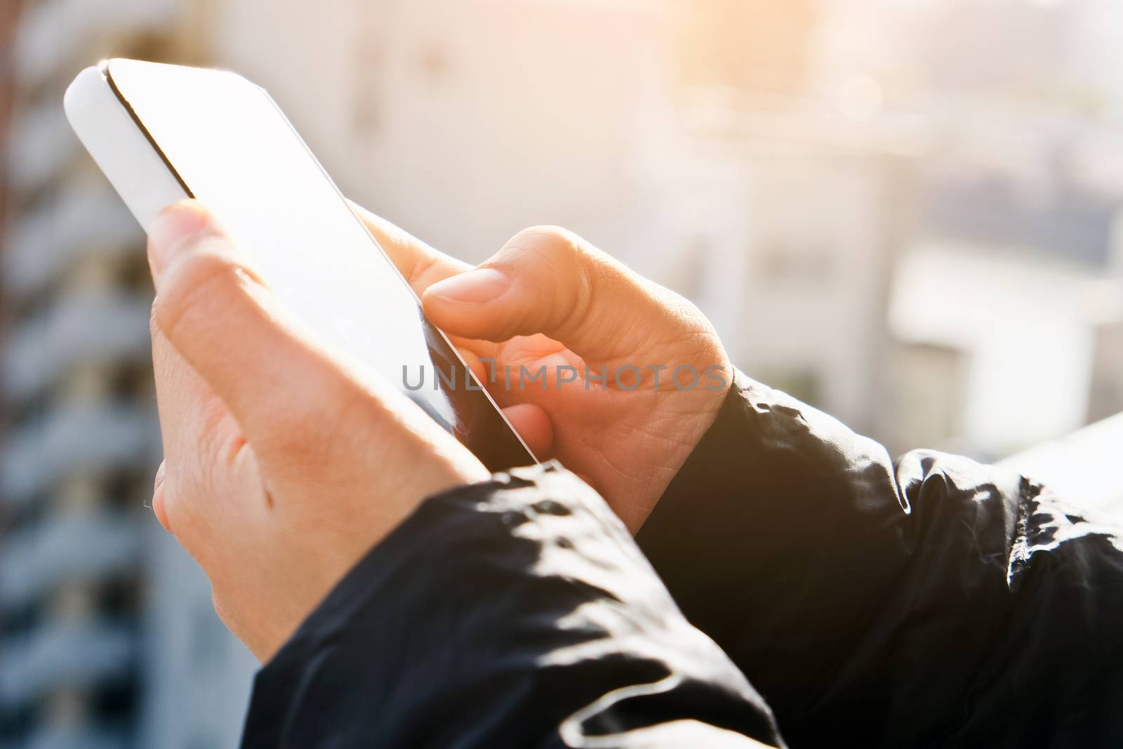 close up of hand typing on phone