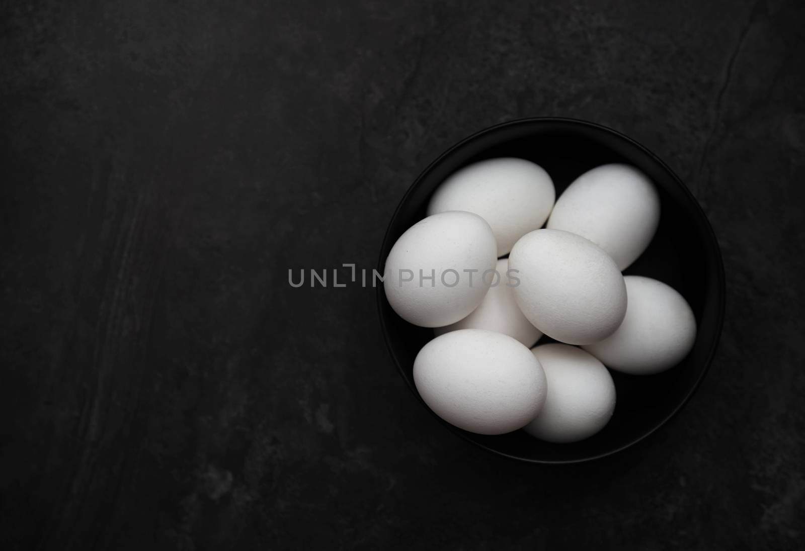 Chicken eggs in a bowl by Novic