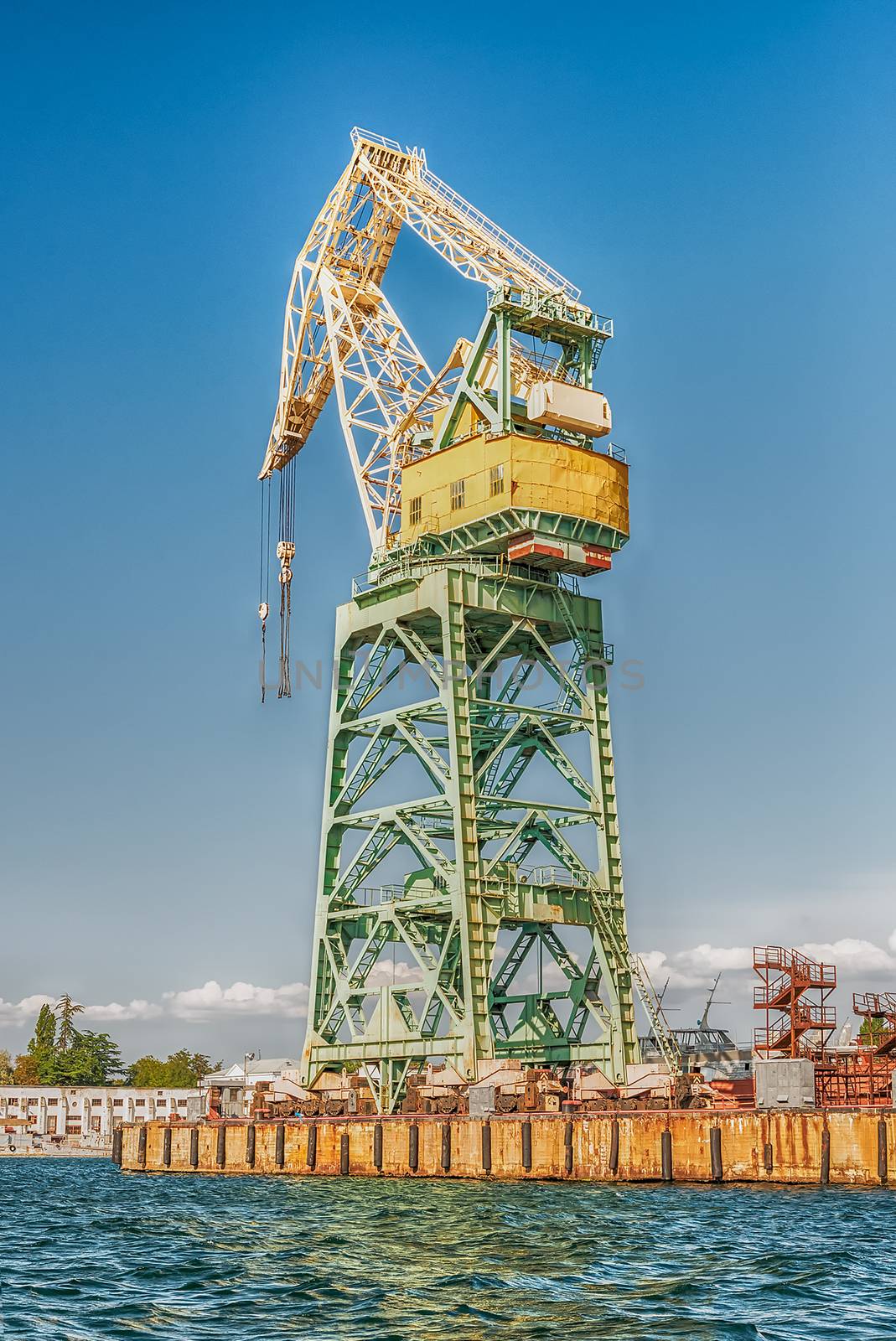 Tower crane in the quay of Sevastopol bay, Crimea by marcorubino