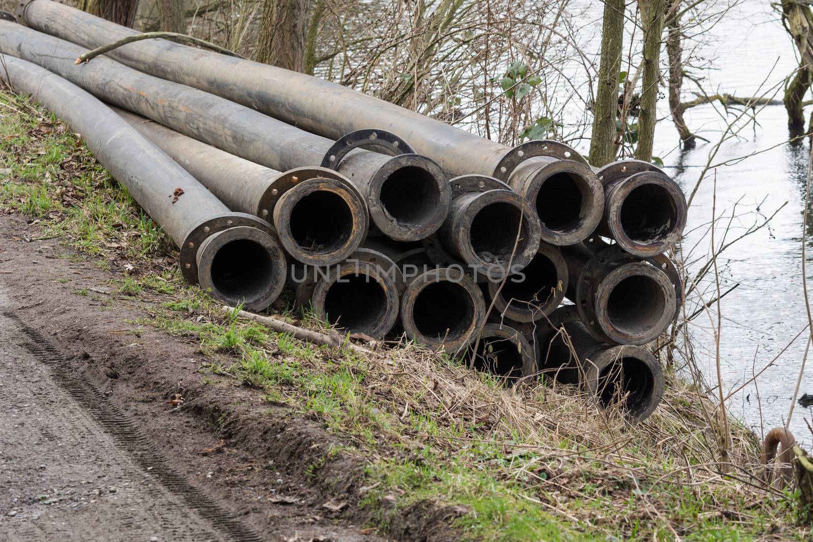 Pipeline, plastic pipes float on the water surface.