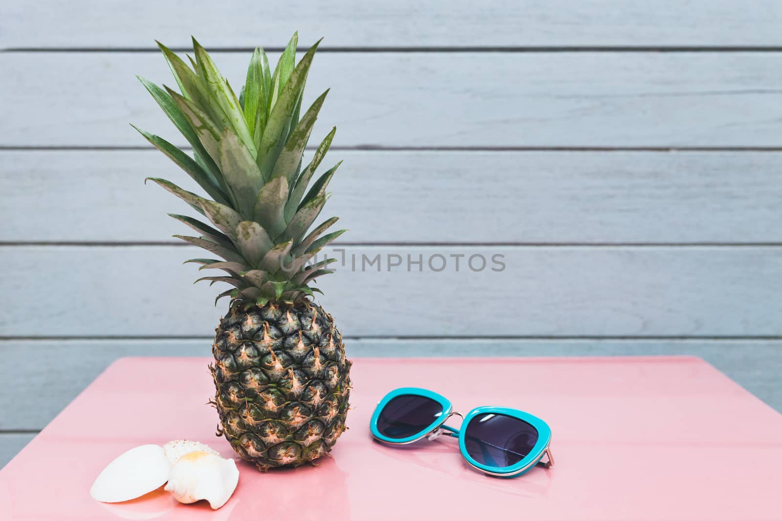 Pineapple on a blue pastel background by nopparats