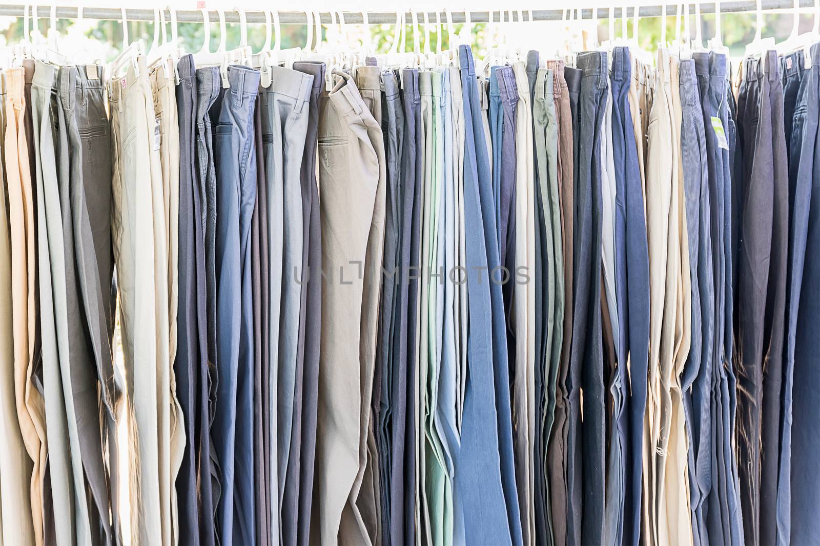 Row of old various woolen trousers  by stoonn