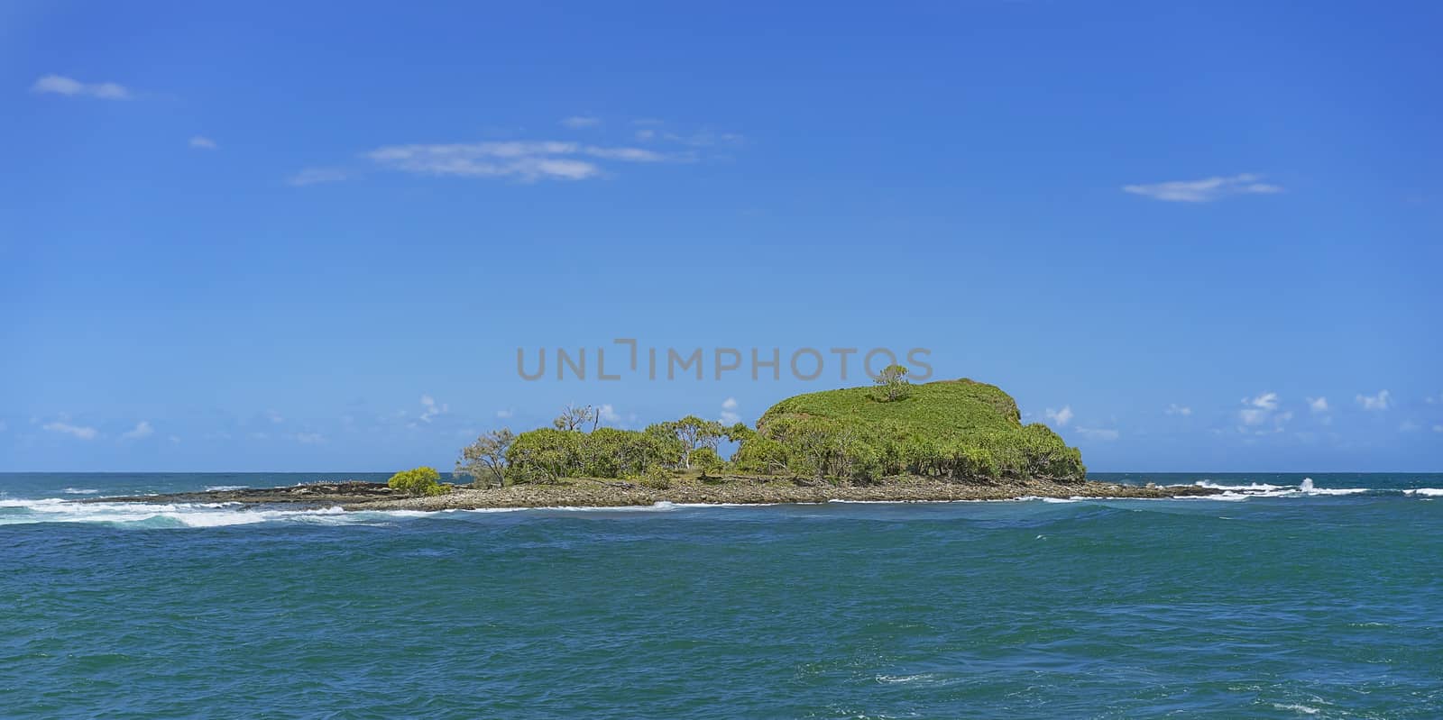 Panoramic landscape view of Old Woman Island or Mudjimba Island Sunshine Coast Queensland surrounded by blue sky and Pacific ocean