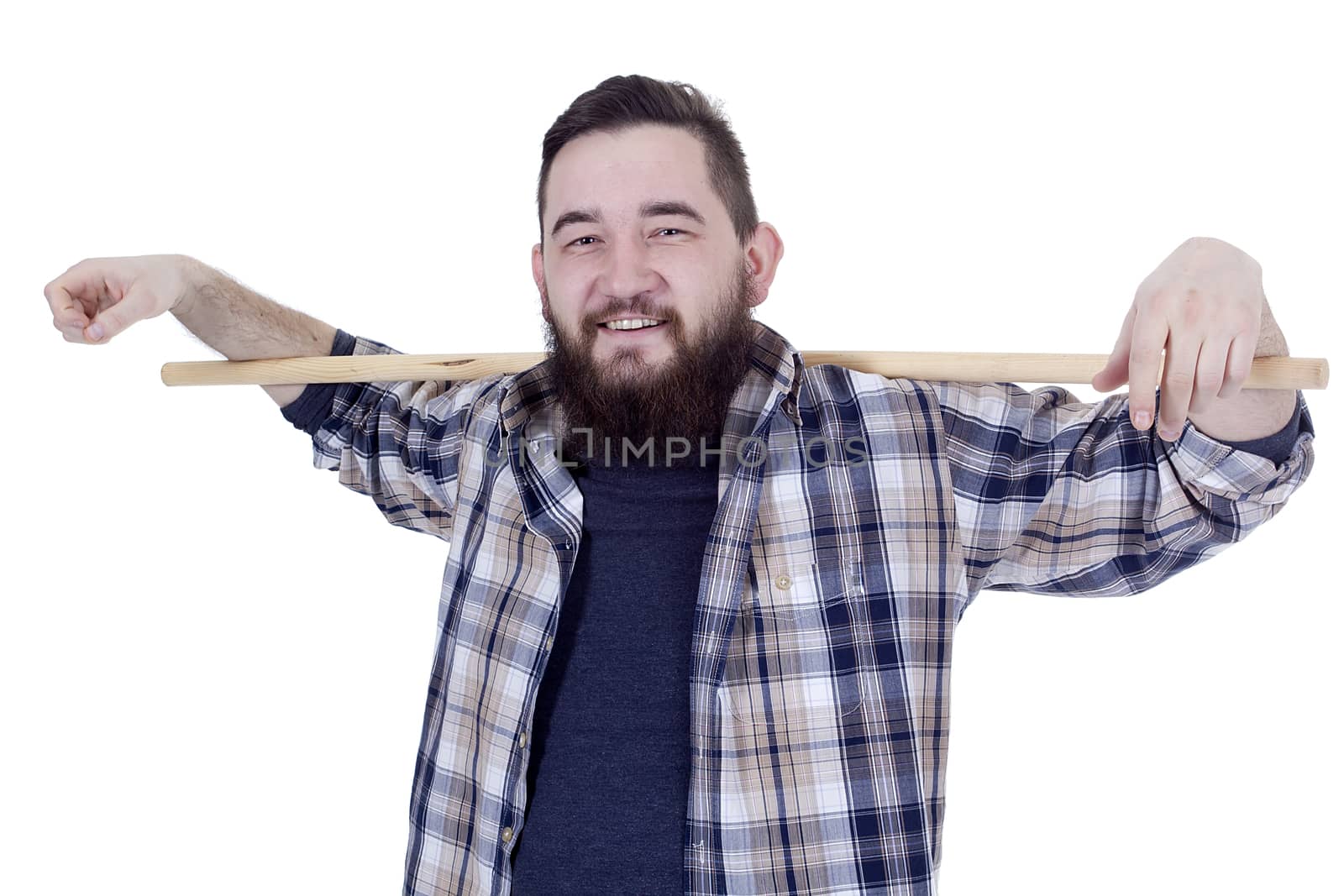 Bearded young farmer in a plaid shirt with a stick on a white background