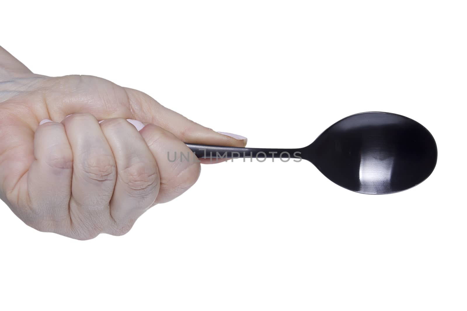 Female hand with a spoon on a white background