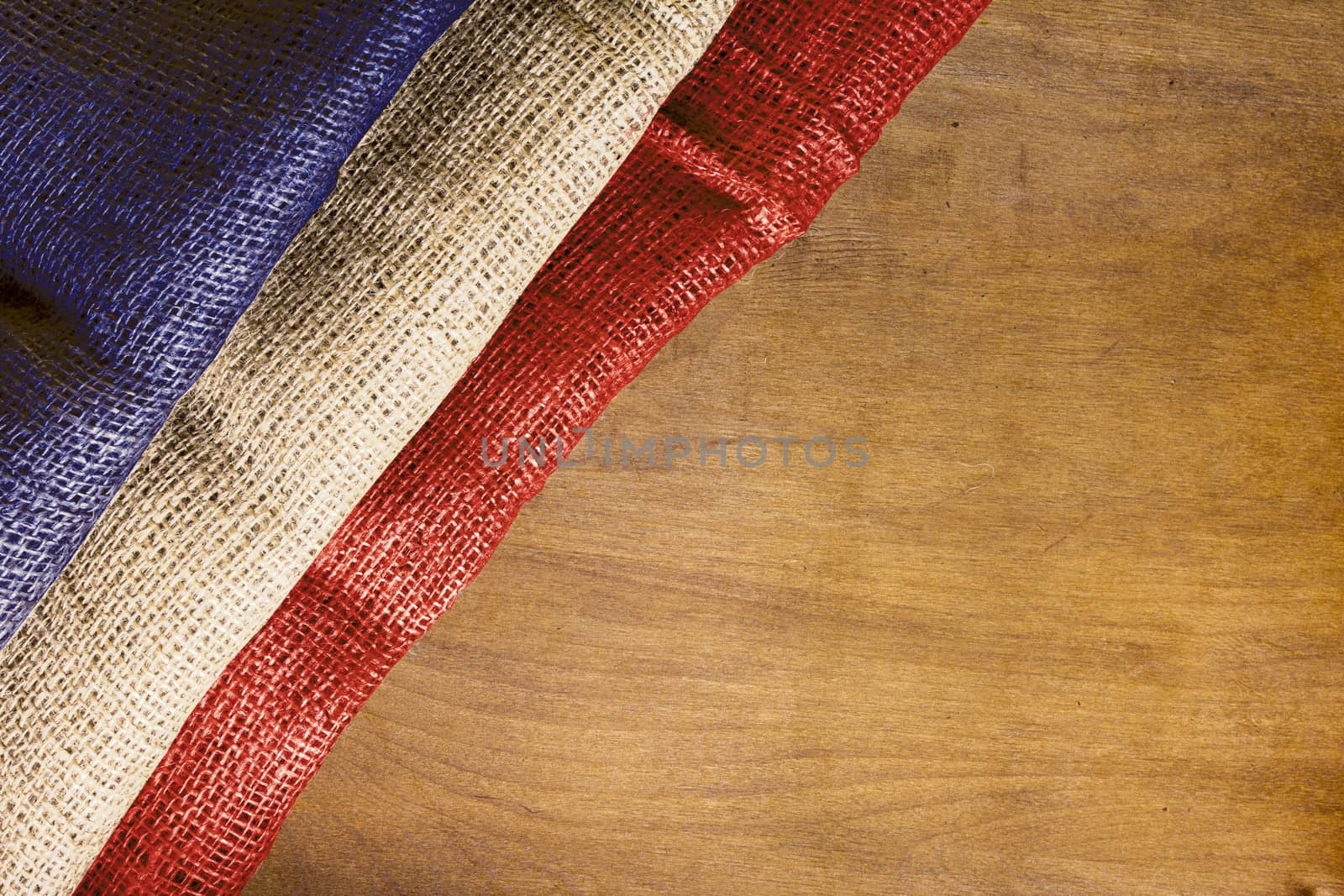 The national flag of France on a wooden surface