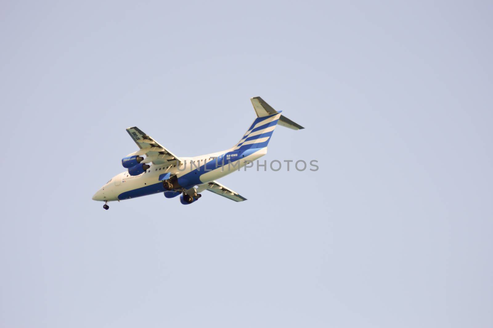 Plane in Greek colors on landing on the island of Crete