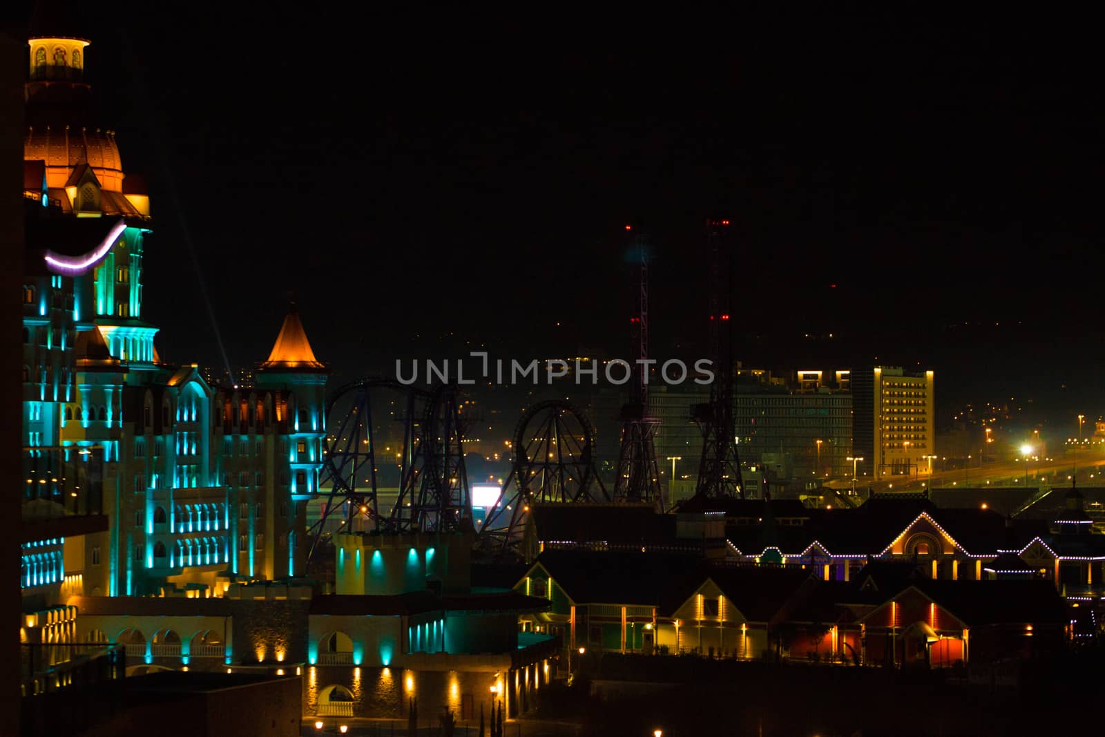 Fantastic view of a big city at night with illuminated modern architecture. by boys1983@mail.ru