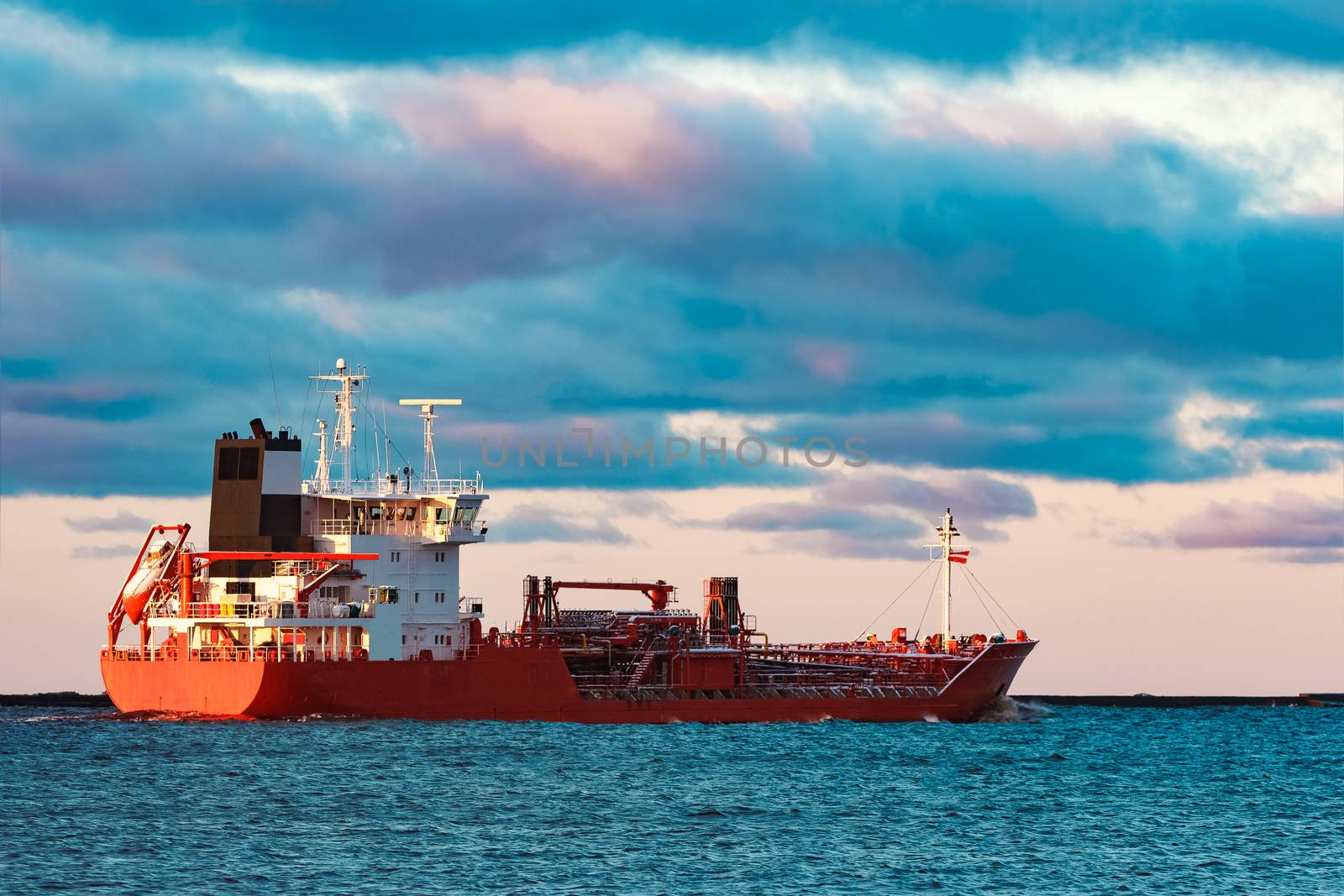 Red cargo oil tanker moving to Baltic sea