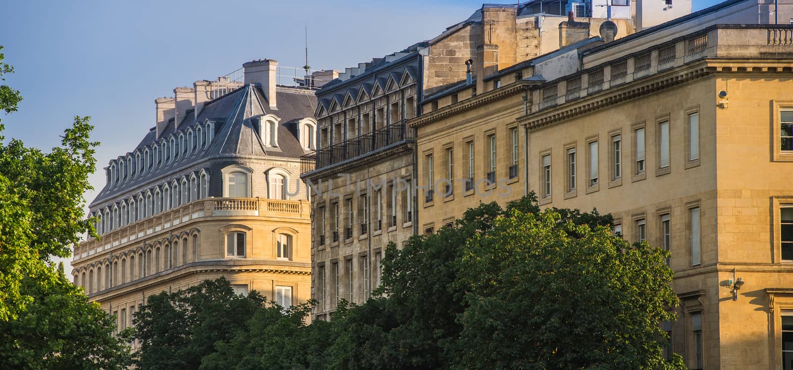 Typical Bordeaux architecture in the centre of Bordeaux, France. Decorative appartment building on spring day.