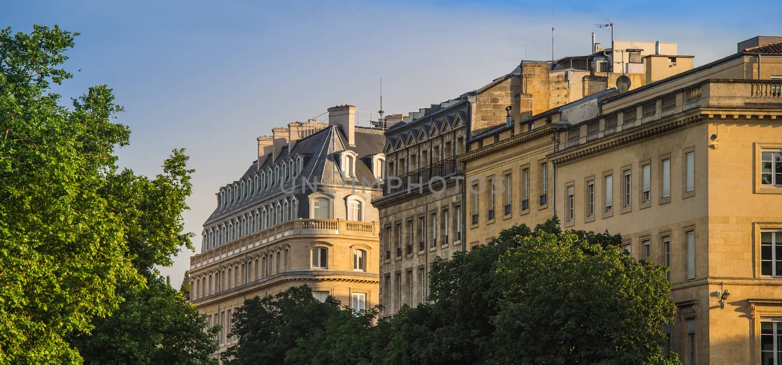 Typical Bordeaux architecture in the centre of Bordeaux, France. Decorative appartment building on spring day.