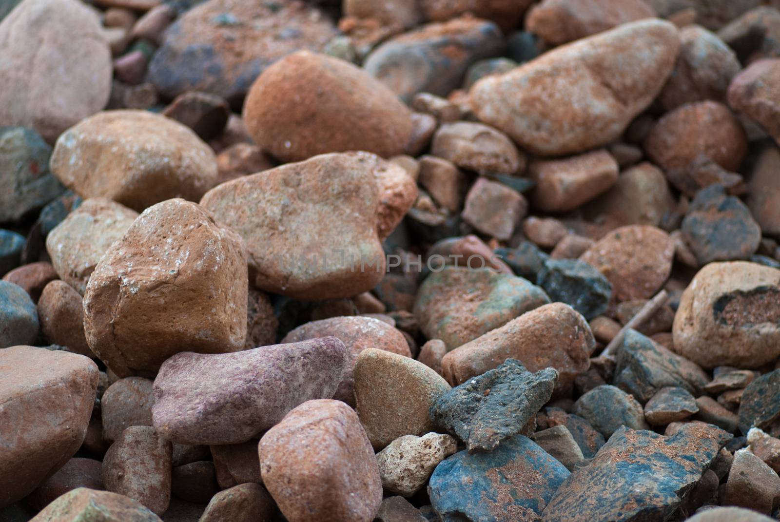 pile of stones near sea bank background texture.