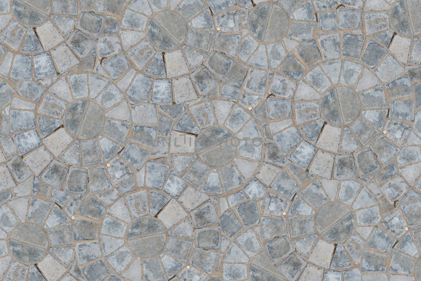 Cobble circular pattern block pavement texture background. Top view.