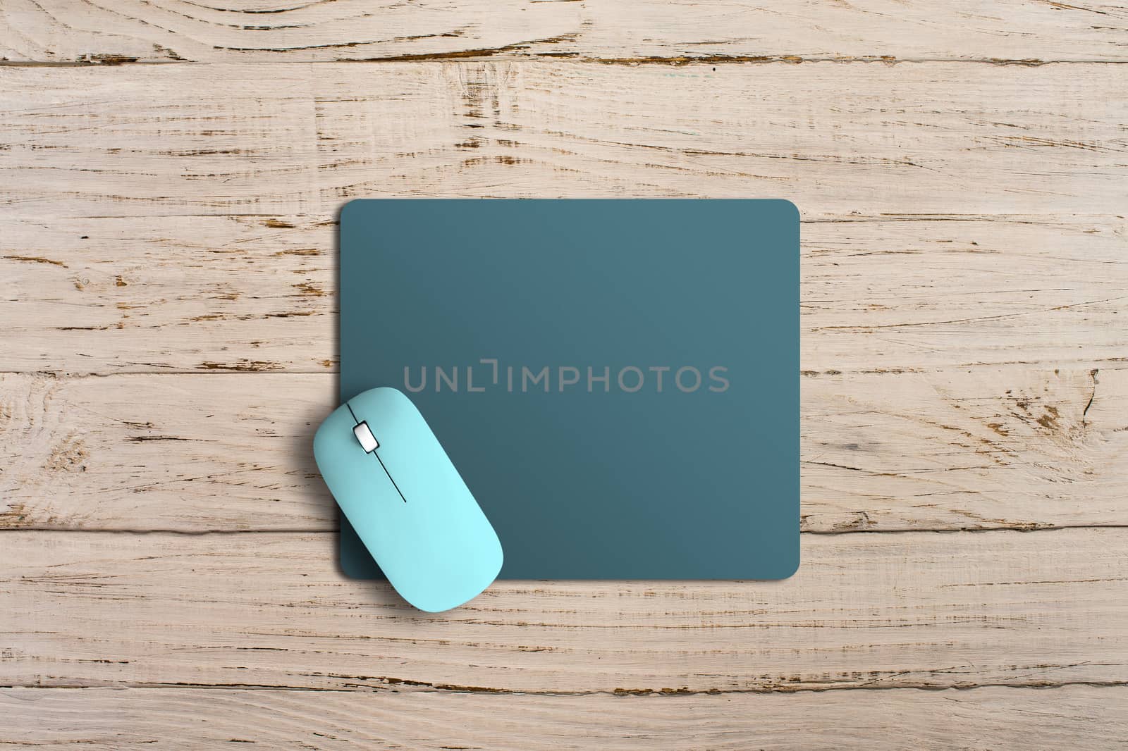 Modern wireless mouse and pad on background