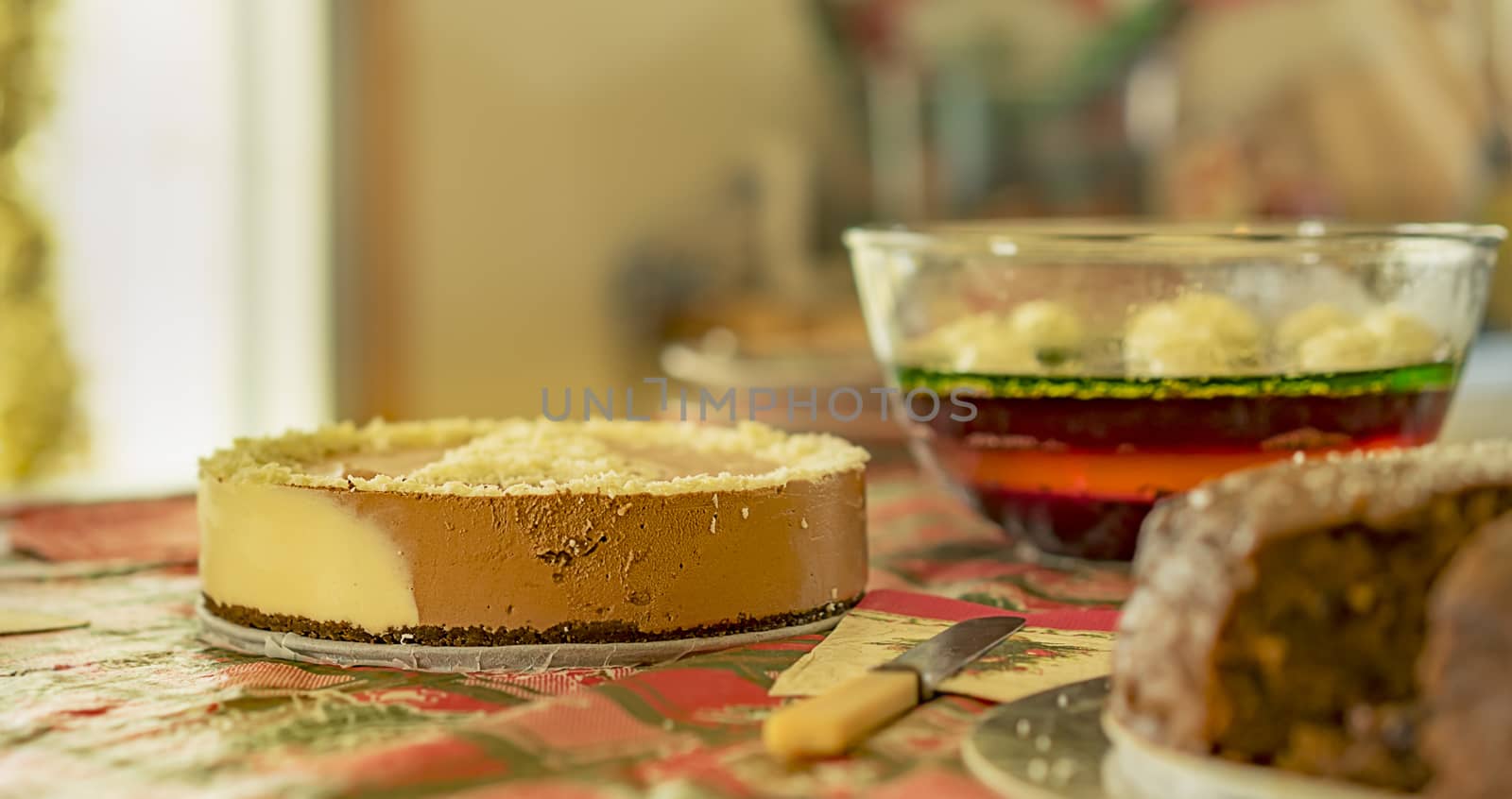 Homemade Christmas fare dessert with cheesecake jelly and cake