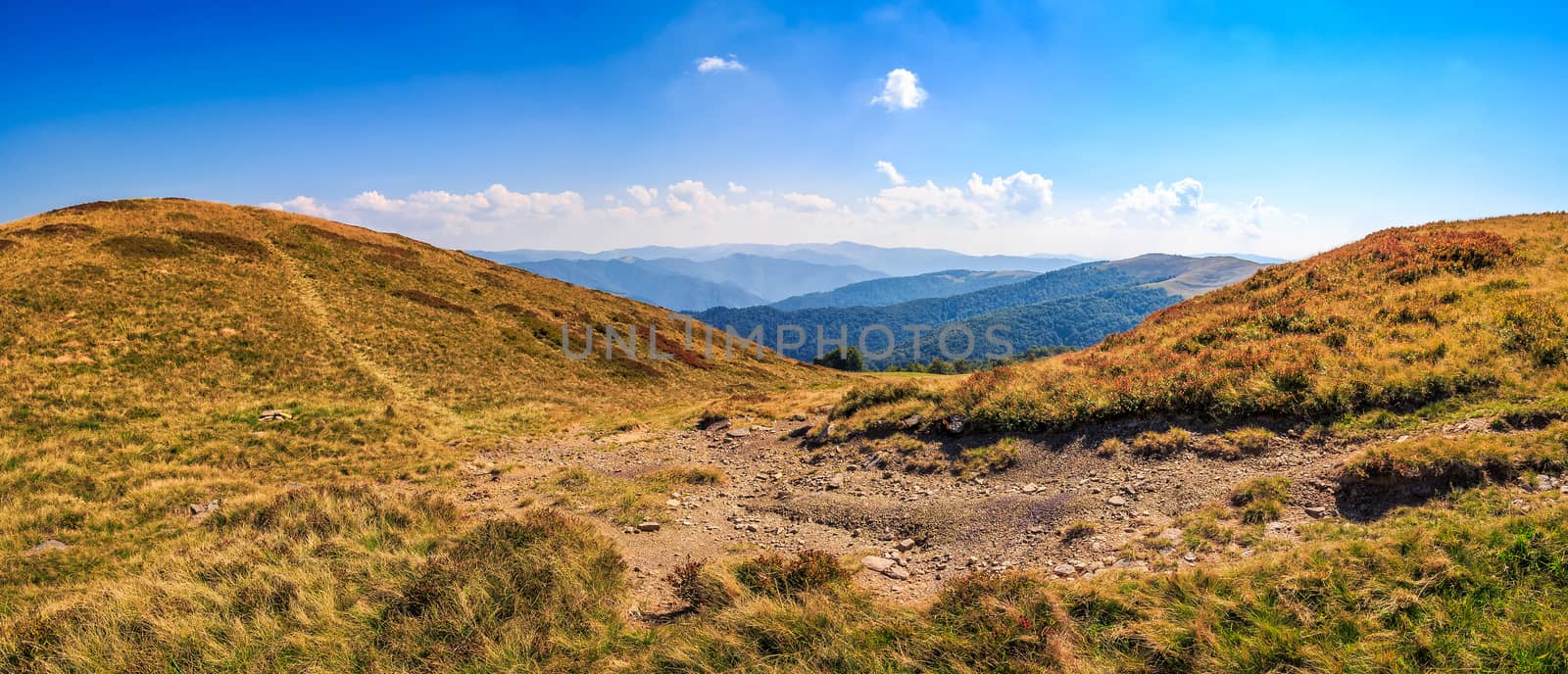 hillside panorama in mountains with path uphill by Pellinni
