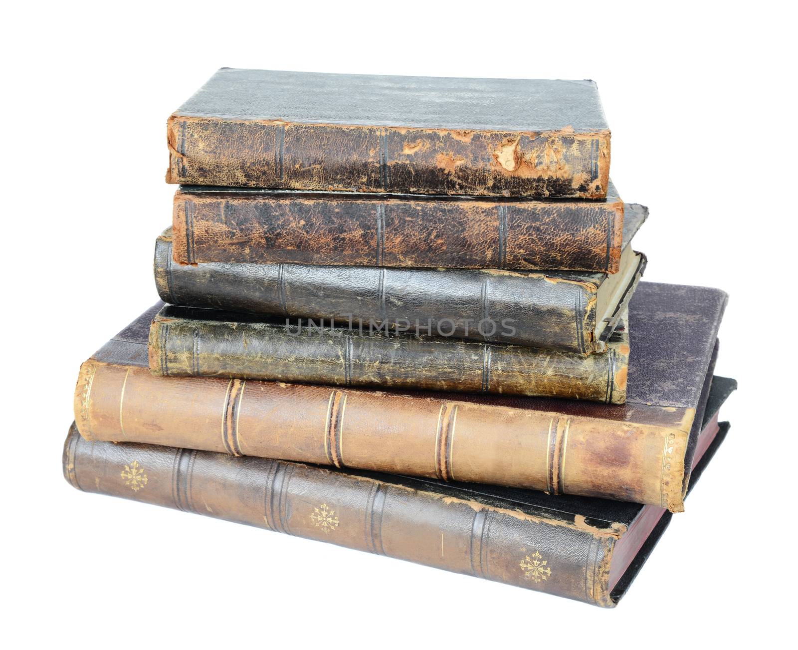 Stack of old hardcover books isolated on white background