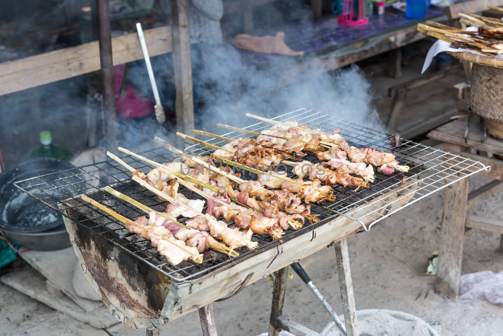 Pork grilled on charcoal (Thai style food) by ahimaone