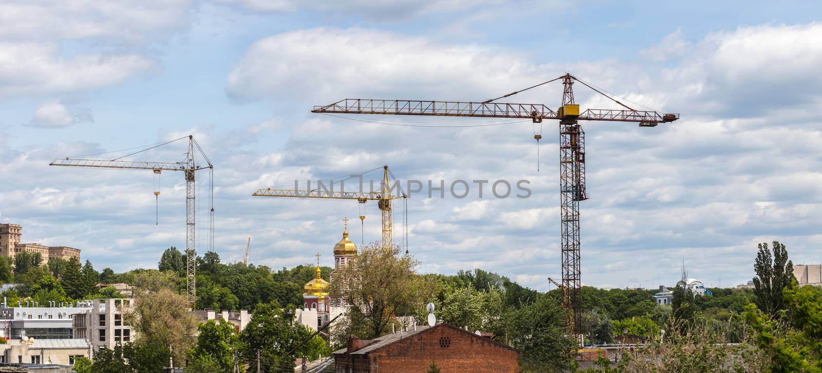 Industrial landscape, construction of high-rise buildings and cranes