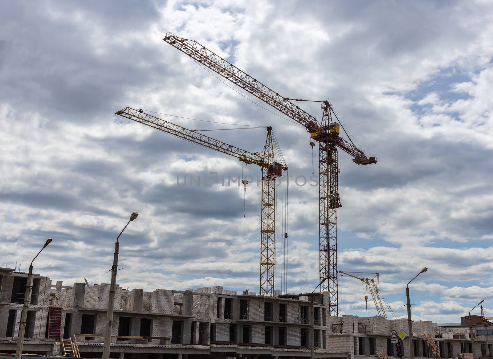 Industrial landscape, construction of high-rise buildings and cranes
