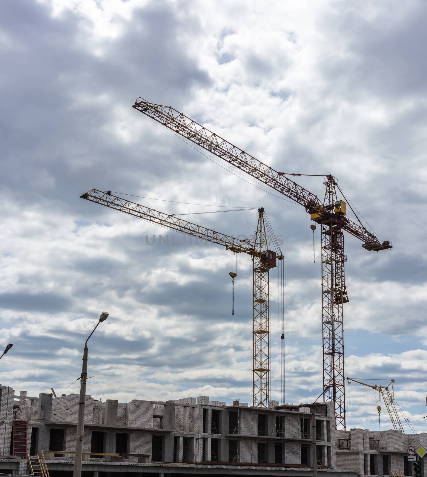 Industrial landscape, construction of high-rise buildings and cranes