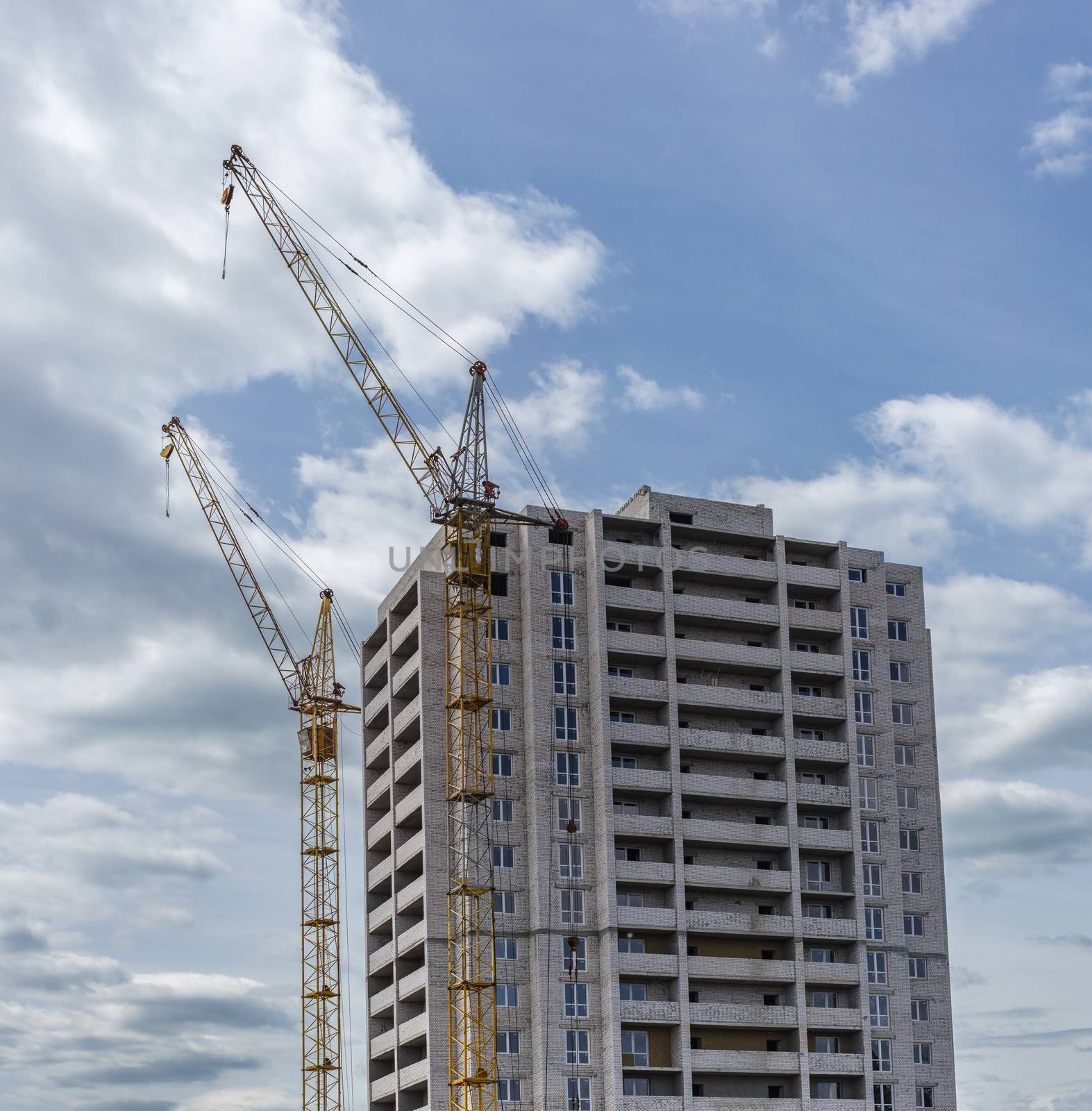 Industrial landscape, construction of high-rise buildings and cranes