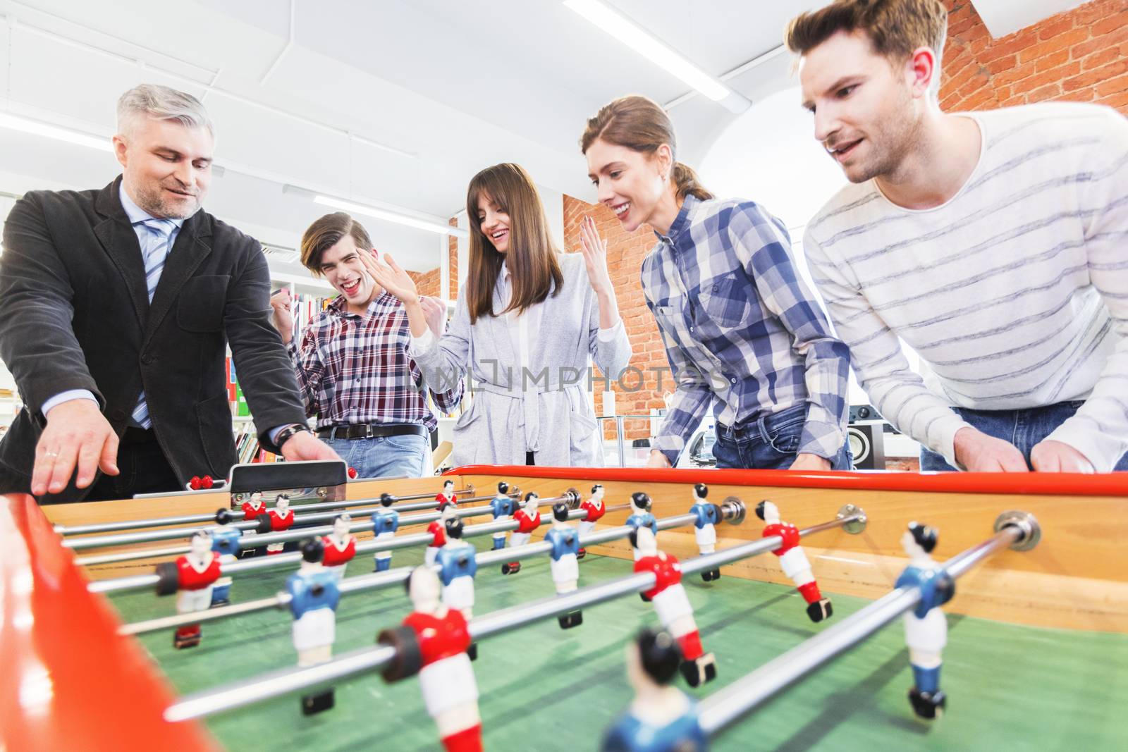 People playing table soccer by Yellowj