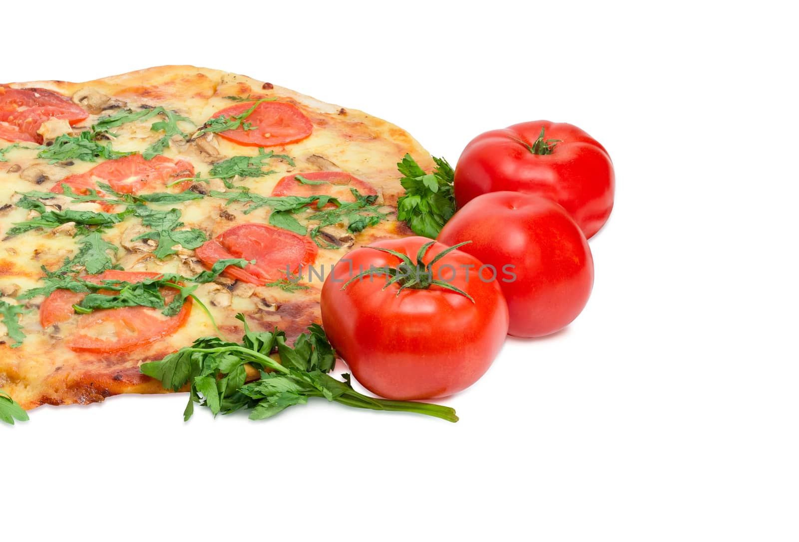 Fragment of the cooked round pizza with tomatoes, mushrooms and arugula and three fresh tomatoes beside on a light background
