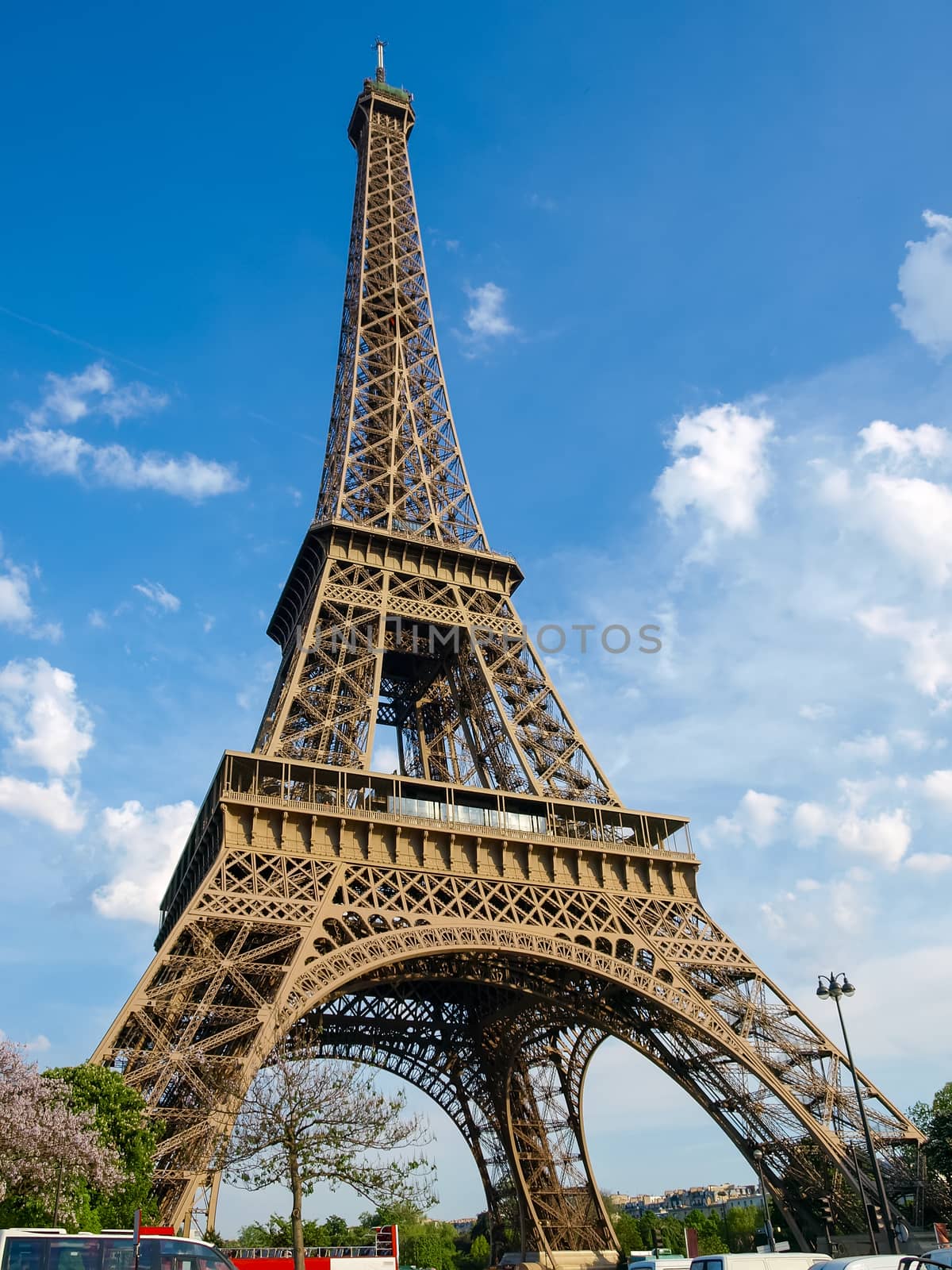 Bottom view of the Eiffel Tower against of the sky in springtime in Paris, France.
