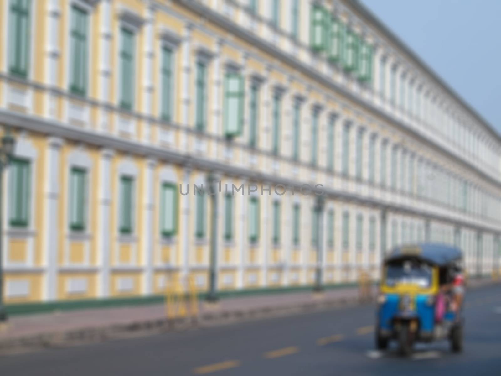 Abstract blurred traditional street taxi call "tuk-tuk" in Bangkok, Thailand.